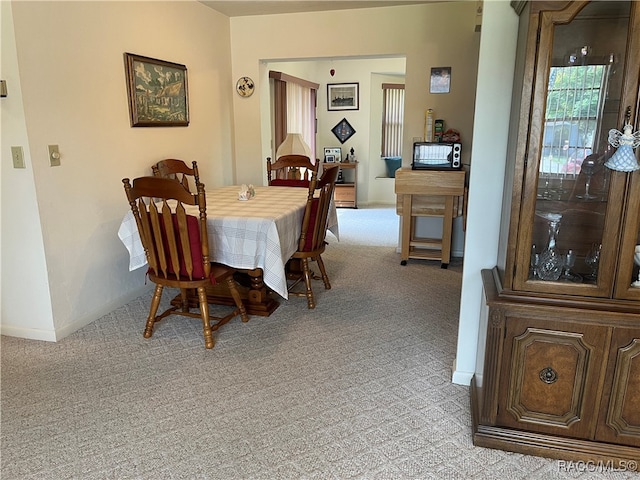 dining area with light carpet