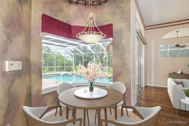 dining area featuring ceiling fan and dark wood-type flooring