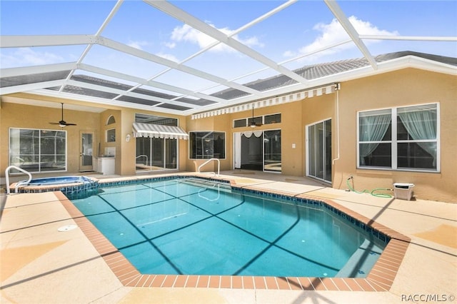 view of swimming pool with an in ground hot tub, a patio, ceiling fan, and a lanai