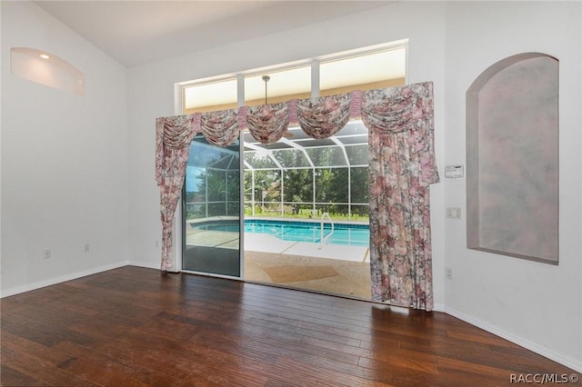 unfurnished room with dark wood-type flooring