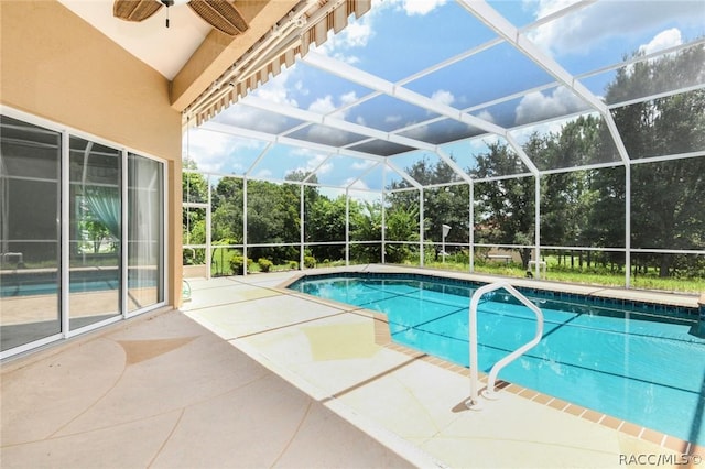 view of pool with a lanai, a patio area, and ceiling fan