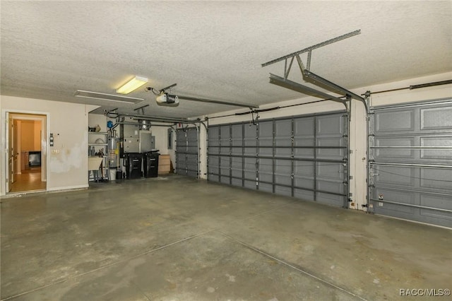 garage with water heater and a garage door opener