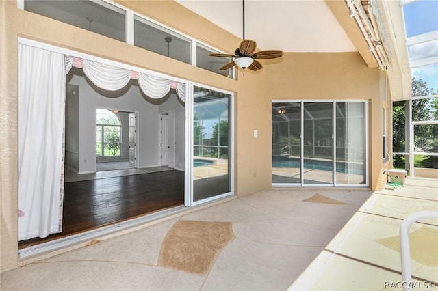 exterior space featuring ceiling fan