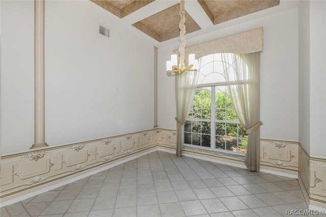 unfurnished dining area featuring a chandelier, light tile patterned floors, coffered ceiling, and beam ceiling