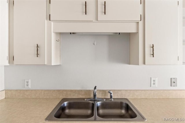 kitchen with sink and white cabinets