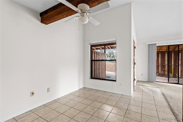 tiled spare room with beamed ceiling, high vaulted ceiling, and ceiling fan