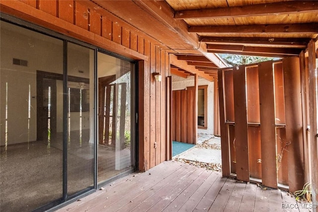 misc room with vaulted ceiling with beams, hardwood / wood-style floors, and wooden ceiling