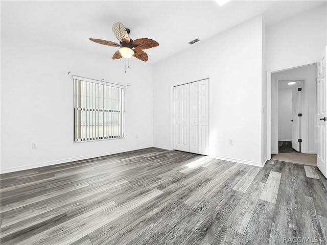 unfurnished room featuring wood-type flooring and ceiling fan