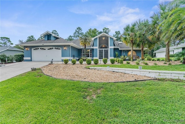 ranch-style house featuring a front yard and a garage