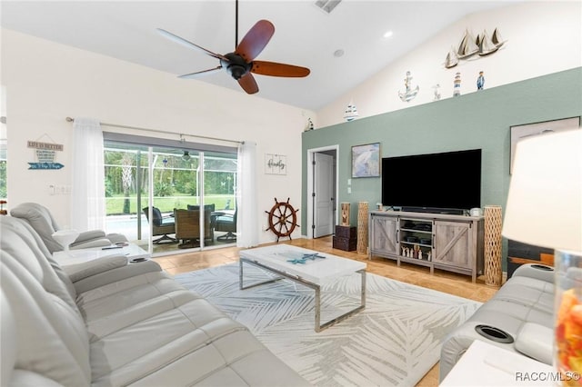 living room featuring ceiling fan and high vaulted ceiling