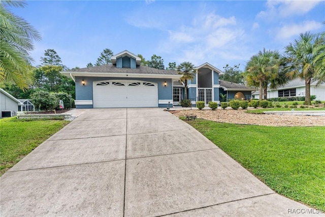 view of front of property with a garage and a front yard