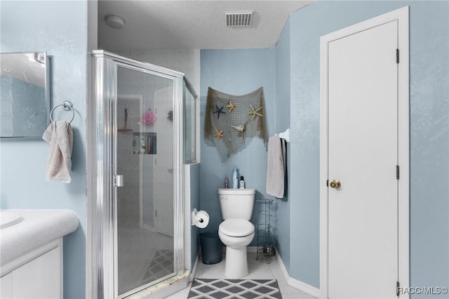 bathroom featuring tile patterned flooring, a shower with shower door, a textured ceiling, and vanity