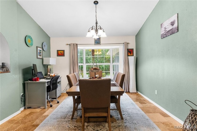 dining area featuring a chandelier