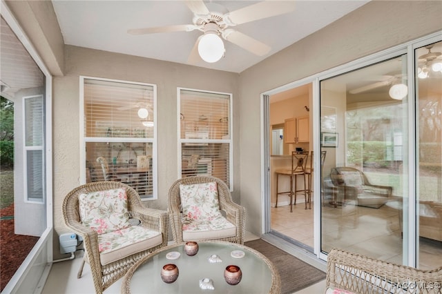 sunroom with ceiling fan