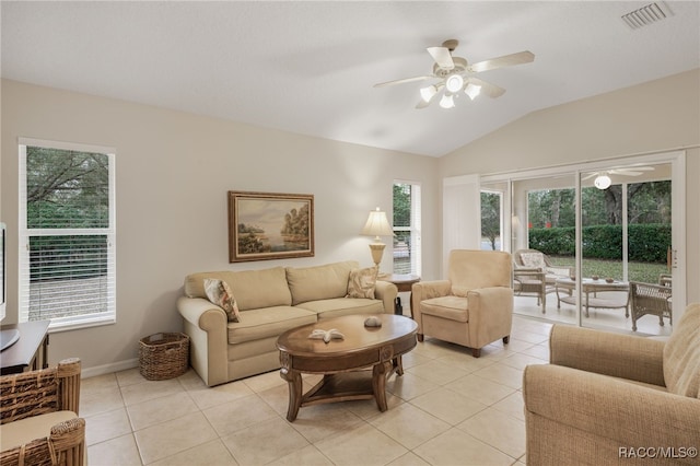 living room with vaulted ceiling, light tile patterned flooring, and ceiling fan