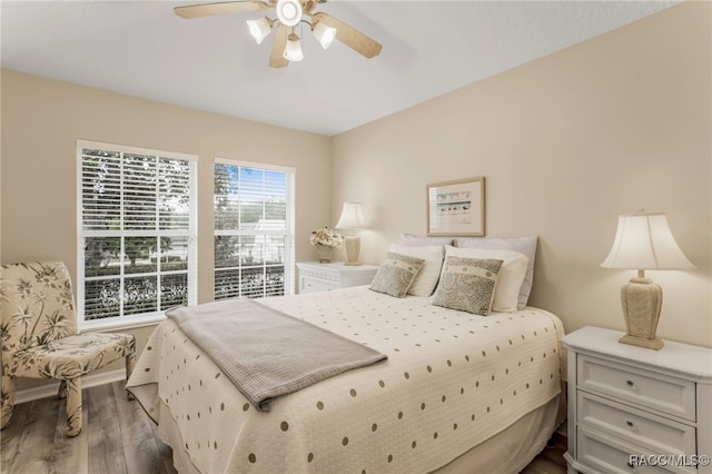 bedroom with hardwood / wood-style floors and ceiling fan