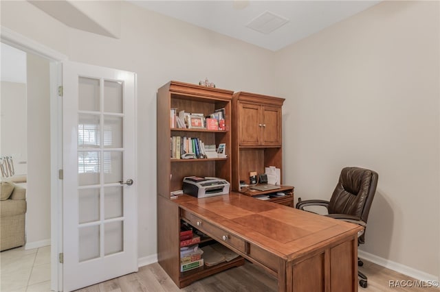 office with light hardwood / wood-style floors