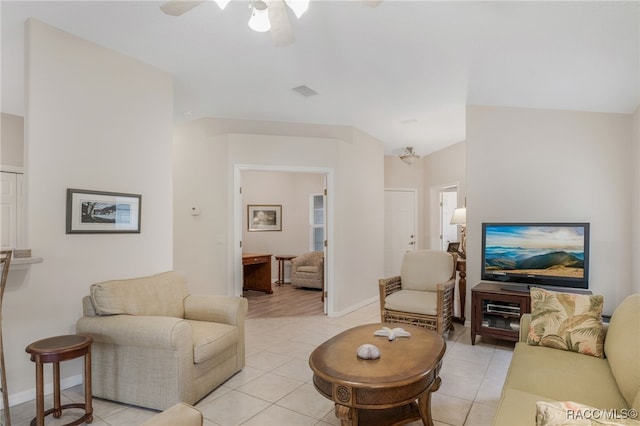 tiled living room with ceiling fan