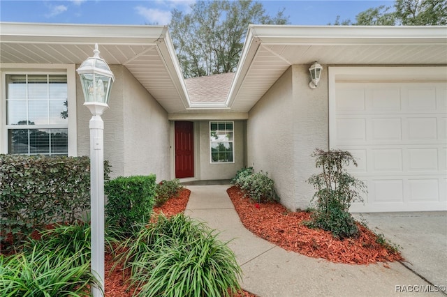 view of exterior entry featuring a garage