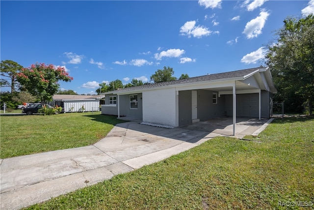 single story home featuring a front yard and a garage