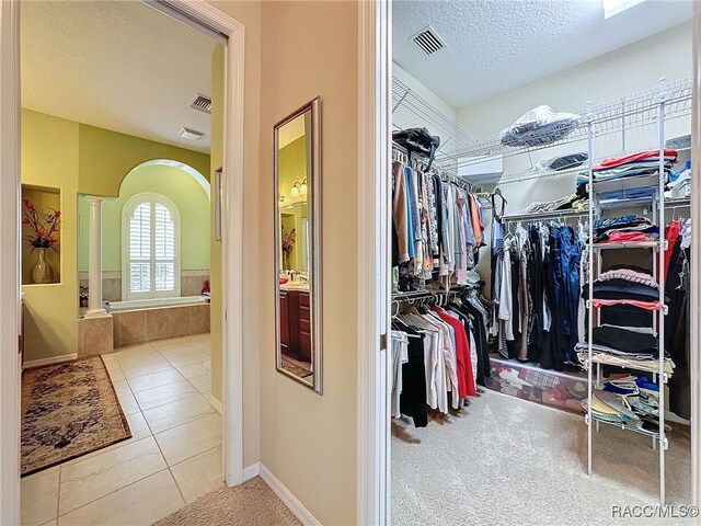 4339 N Canarywood Ter, Beverly Hills, FL 34465 - walk in closet featuring tile patterned flooring and decorative columns