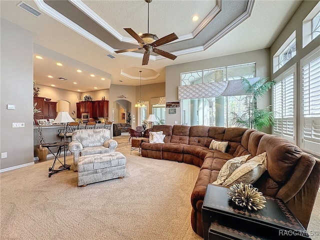 4339 N Canarywood Ter, Beverly Hills, FL 34465 - living room featuring a raised ceiling, crown molding, carpet floors, and ceiling fan