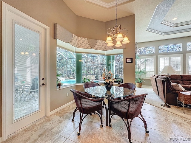 4339 N Canarywood Ter, Beverly Hills, FL 34465 - dining area featuring crown molding, a notable chandelier, a tray ceiling, and plenty of natural light
