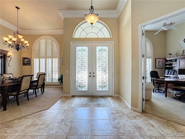 4339 N Canarywood Ter, Beverly Hills, FL 34465 - foyer entrance featuring light carpet, ornamental molding, and french doors