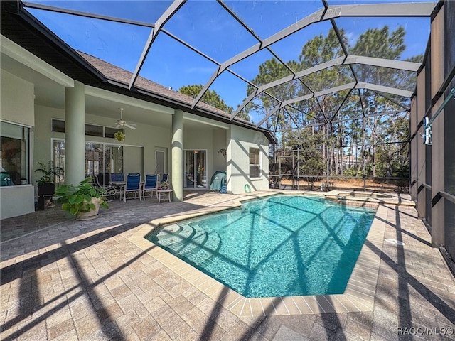 4339 N Canarywood Ter, Beverly Hills, FL 34465 - view of swimming pool featuring ceiling fan, a patio area, and glass enclosure