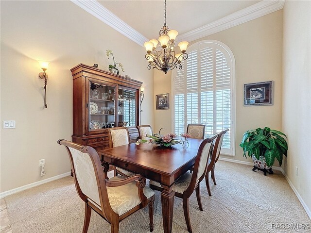 4339 N Canarywood Ter, Beverly Hills, FL 34465 - carpeted dining room with ornamental molding and an inviting chandelier
