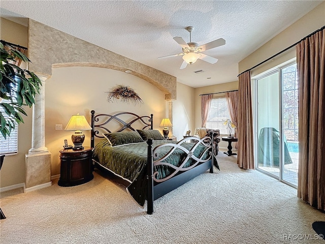 4339 N Canarywood Ter, Beverly Hills, FL 34465 - bedroom with ceiling fan, access to outside, a textured ceiling, and carpet