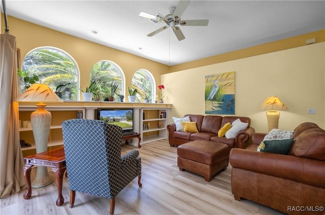 interior space featuring wood finished floors and ceiling fan