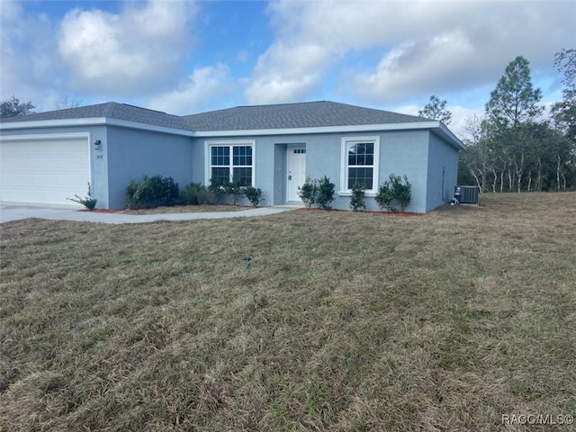 ranch-style house with a garage, central AC unit, and a front lawn