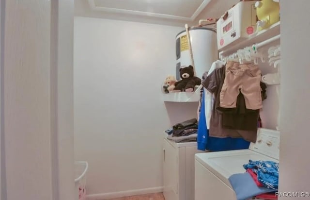 washroom featuring water heater and washing machine and clothes dryer