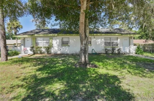 back of house featuring a lawn