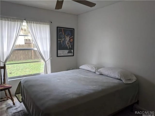 bedroom featuring ceiling fan and wood-type flooring