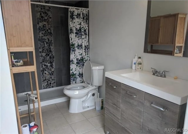 bathroom with tile patterned flooring, vanity, toilet, and walk in shower