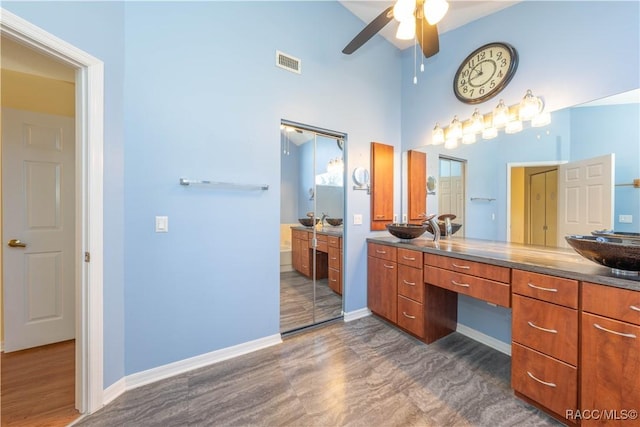 bathroom with vanity and ceiling fan