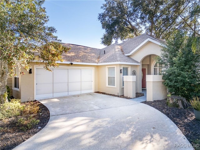 single story home with a garage