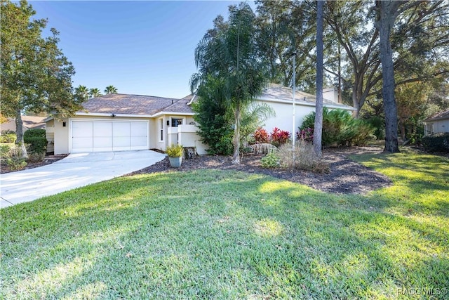 ranch-style home featuring a garage and a front lawn