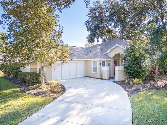 ranch-style home with a garage