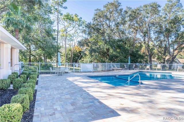 view of swimming pool with a patio area