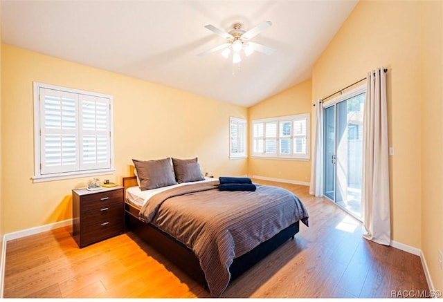 bedroom featuring access to exterior, light wood-type flooring, vaulted ceiling, and ceiling fan