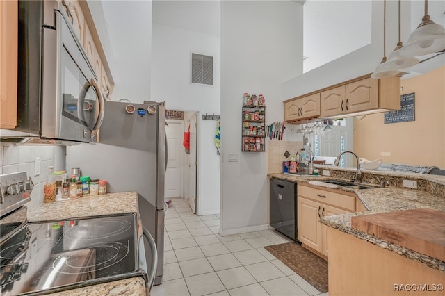 7690 N Greendale Dr, Citrus Springs, FL 34434 - kitchen featuring stainless steel appliances, a sink, light brown cabinetry, a towering ceiling, and light tile patterned flooring
