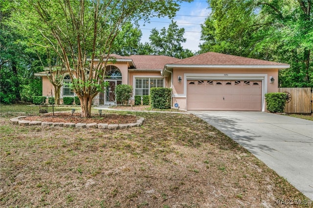 7690 N Greendale Dr, Citrus Springs, FL 34434 - ranch-style house with stucco siding, an attached garage, concrete driveway, and roof with shingles