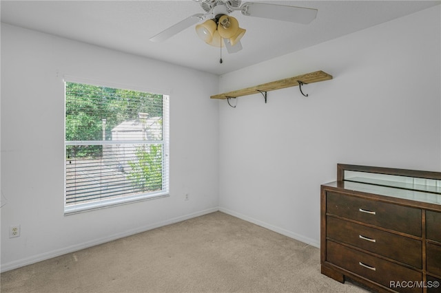 7690 N Greendale Dr, Citrus Springs, FL 34434 - unfurnished room featuring light colored carpet, ceiling fan, and baseboards