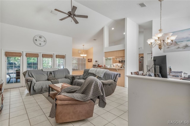 7690 N Greendale Dr, Citrus Springs, FL 34434 - living room with high vaulted ceiling, a chandelier, light tile patterned floors, a ceiling fan, and healthy amount of natural light