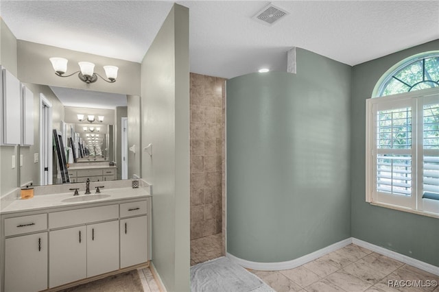 7690 N Greendale Dr, Citrus Springs, FL 34434 - bathroom with vanity, baseboards, a textured ceiling, walk in shower, and a chandelier