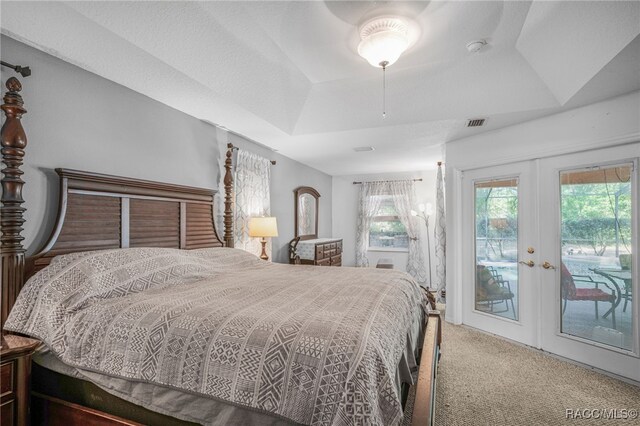 7690 N Greendale Dr, Citrus Springs, FL 34434 - bedroom with access to outside, carpet flooring, french doors, a raised ceiling, and a ceiling fan