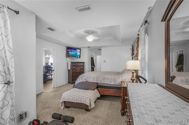7690 N Greendale Dr, Citrus Springs, FL 34434 - carpeted bedroom with a tray ceiling